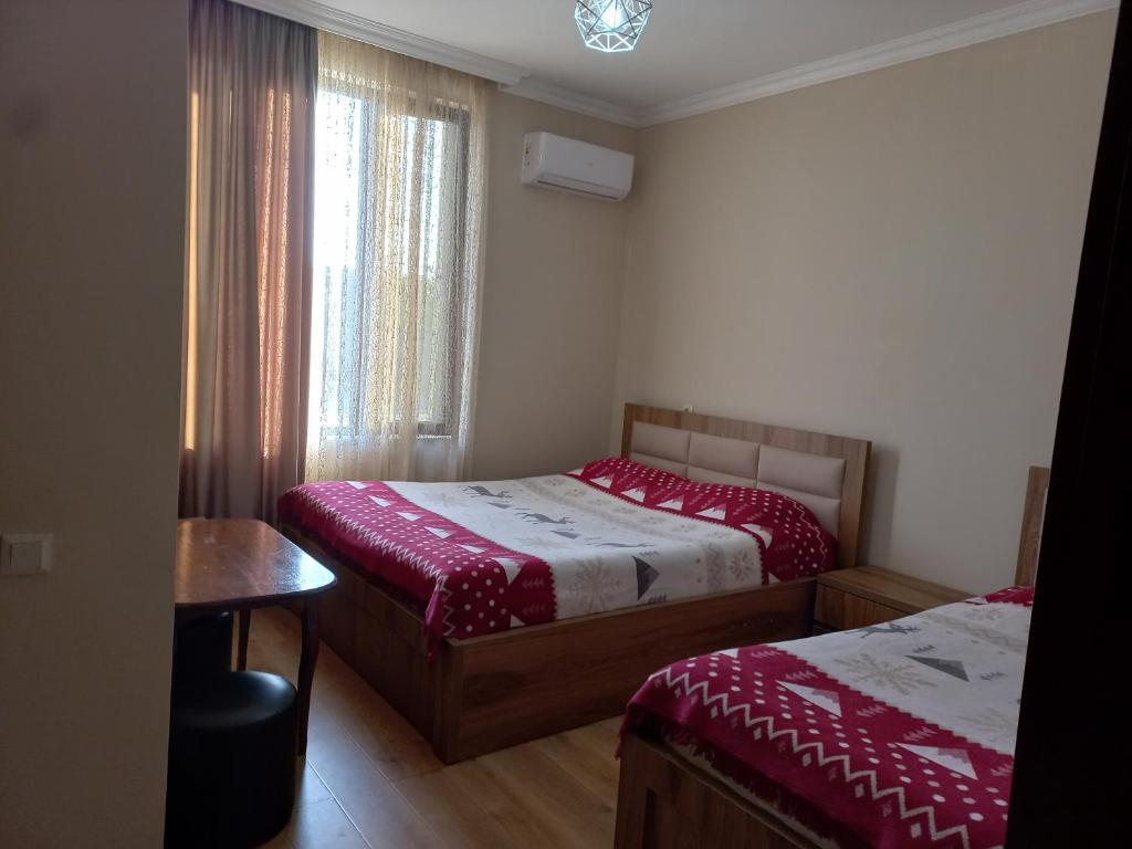Postel nebo postele na pokoji v ubytování Mate's GUEST HOUSE