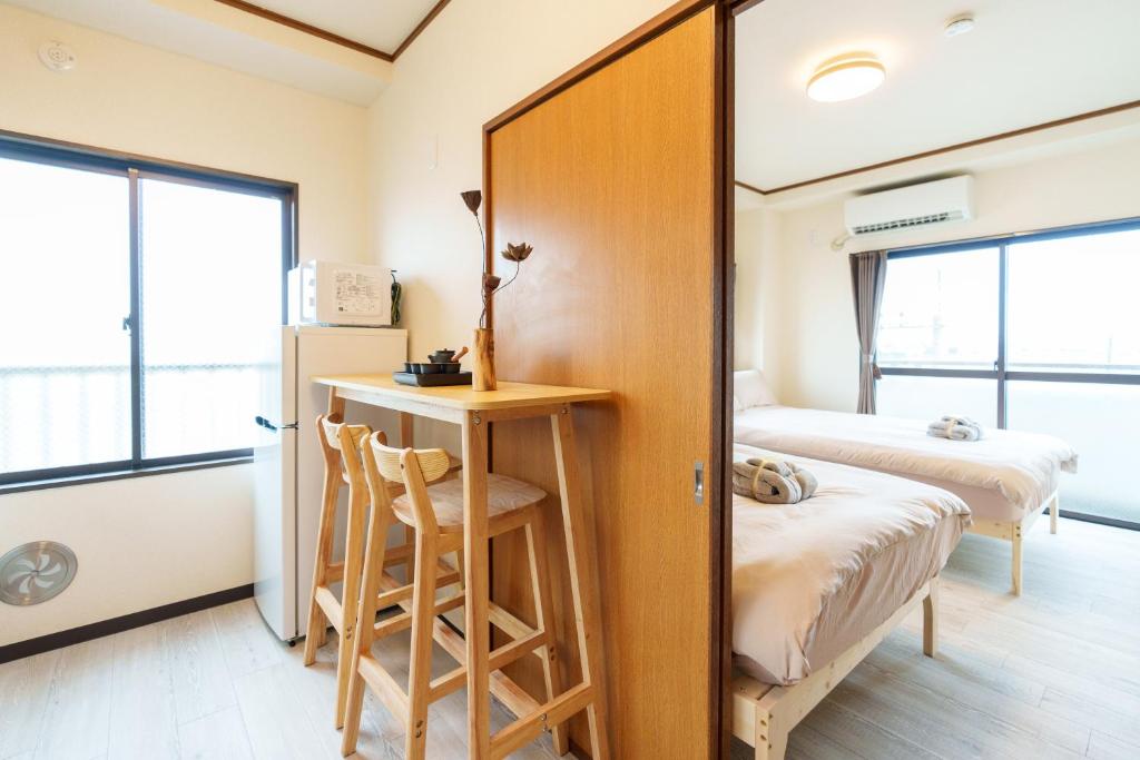 Postel nebo postele na pokoji v ubytování 静心宿Tranquil Retreat 4F晴空塔直达东京河景民宿
