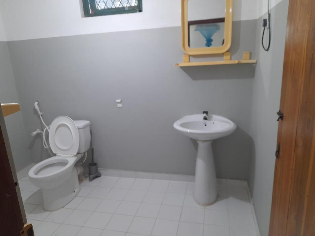 Koupelna v ubytování Devi Tourist Home