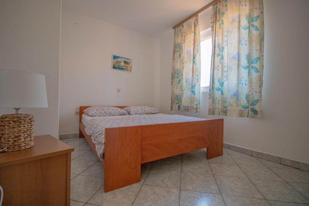 Posteľ alebo postele v izbe v ubytovaní Apartments Petar Maksan