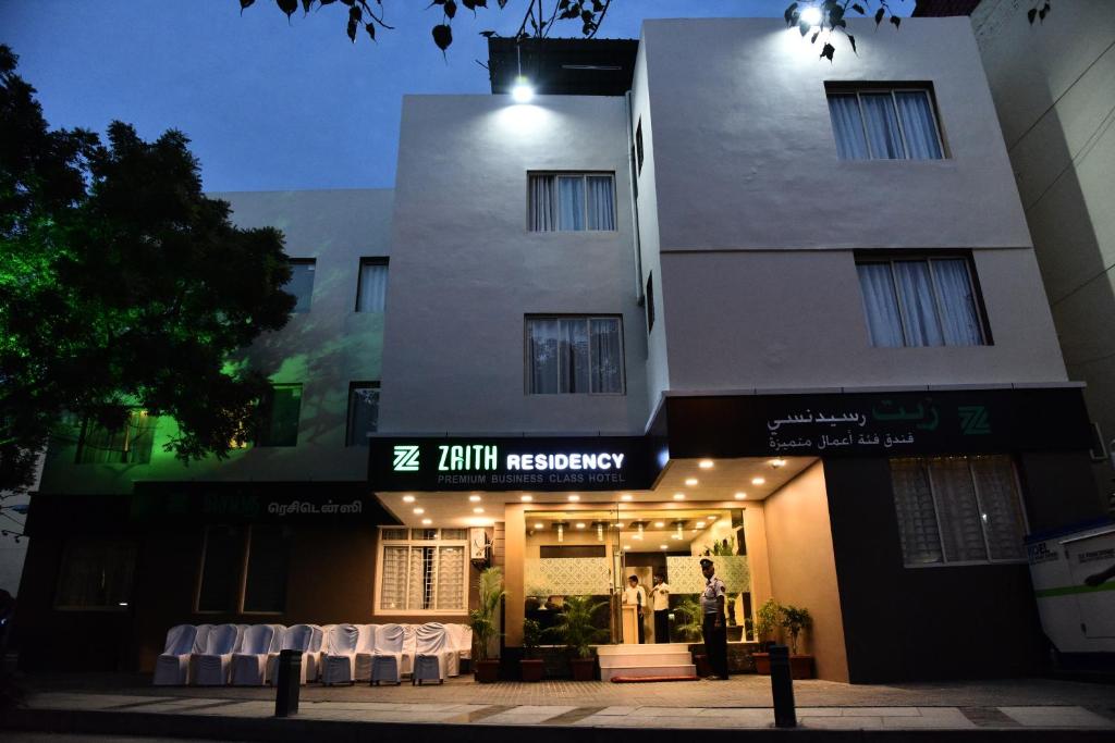 a store front of a building with tables in front of it at Zaith Residency Near US Consulate & Apollo hospitals in Chennai
