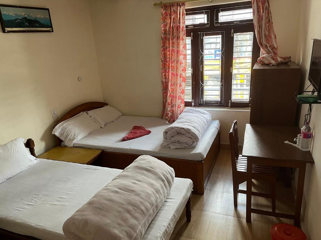 Postel nebo postele na pokoji v ubytování New elites guest house