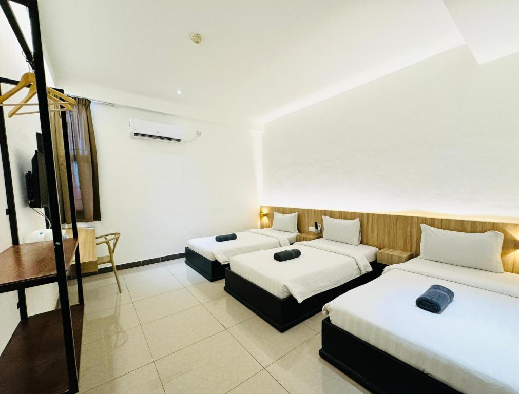 Postel nebo postele na pokoji v ubytování Mangrove Hotel Tawau