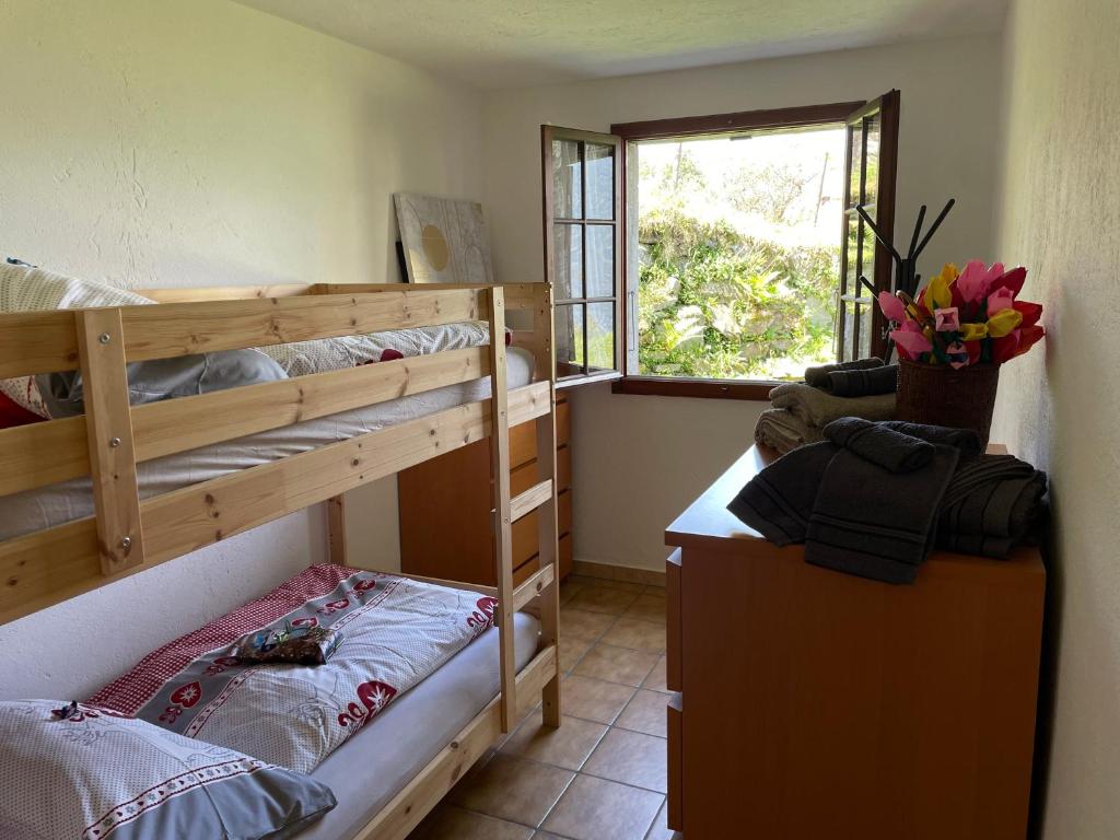Postel nebo postele na pokoji v ubytování Ferienwohnung Rustico ai Monti