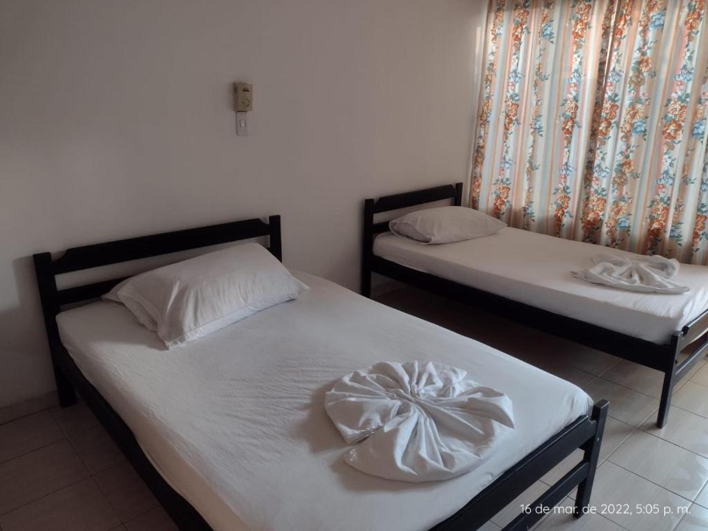 Postel nebo postele na pokoji v ubytování Hotel Tame Real
