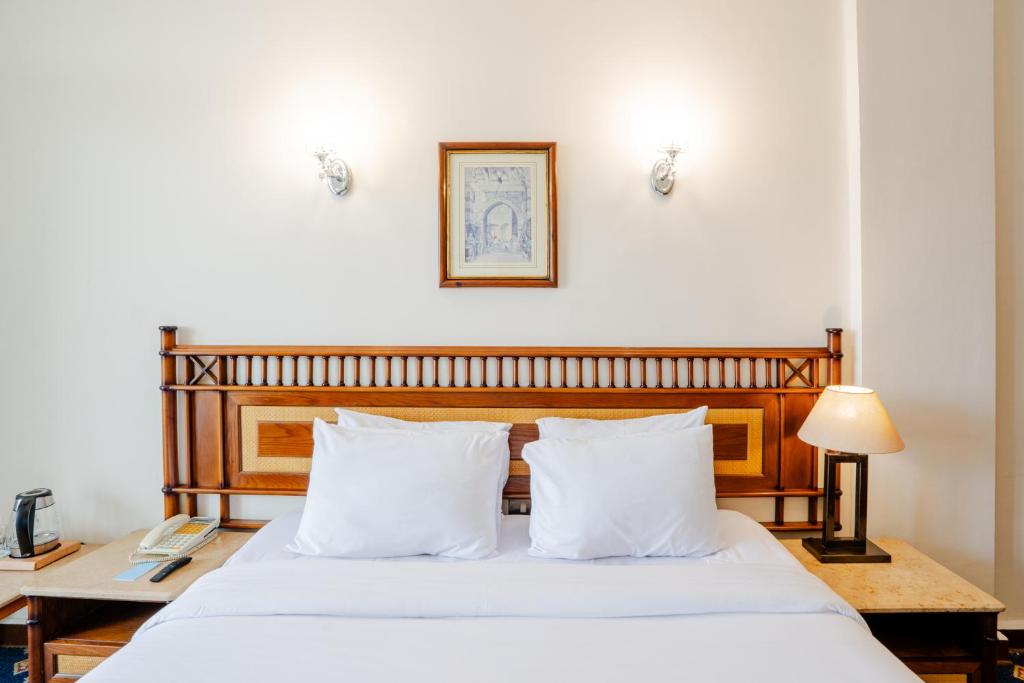 Postel nebo postele na pokoji v ubytování Om Kolthoom Hotel