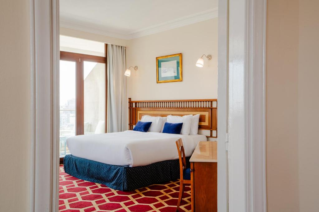 Postel nebo postele na pokoji v ubytování Om Kolthoom Hotel