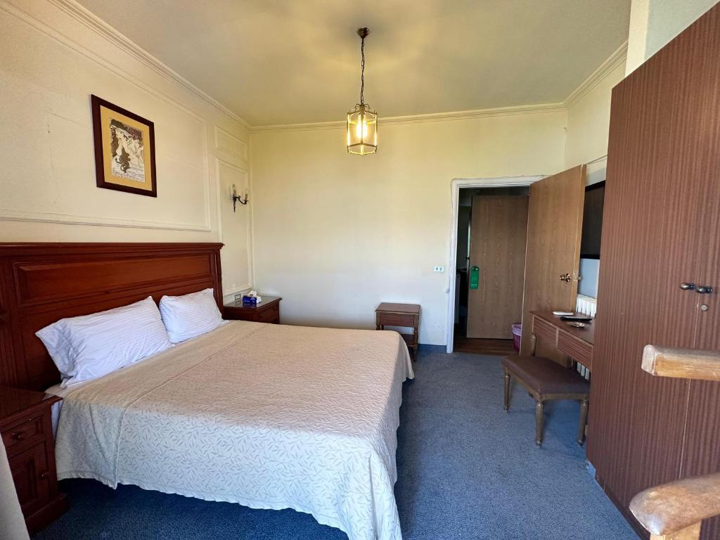 Postel nebo postele na pokoji v ubytování Le Crillon