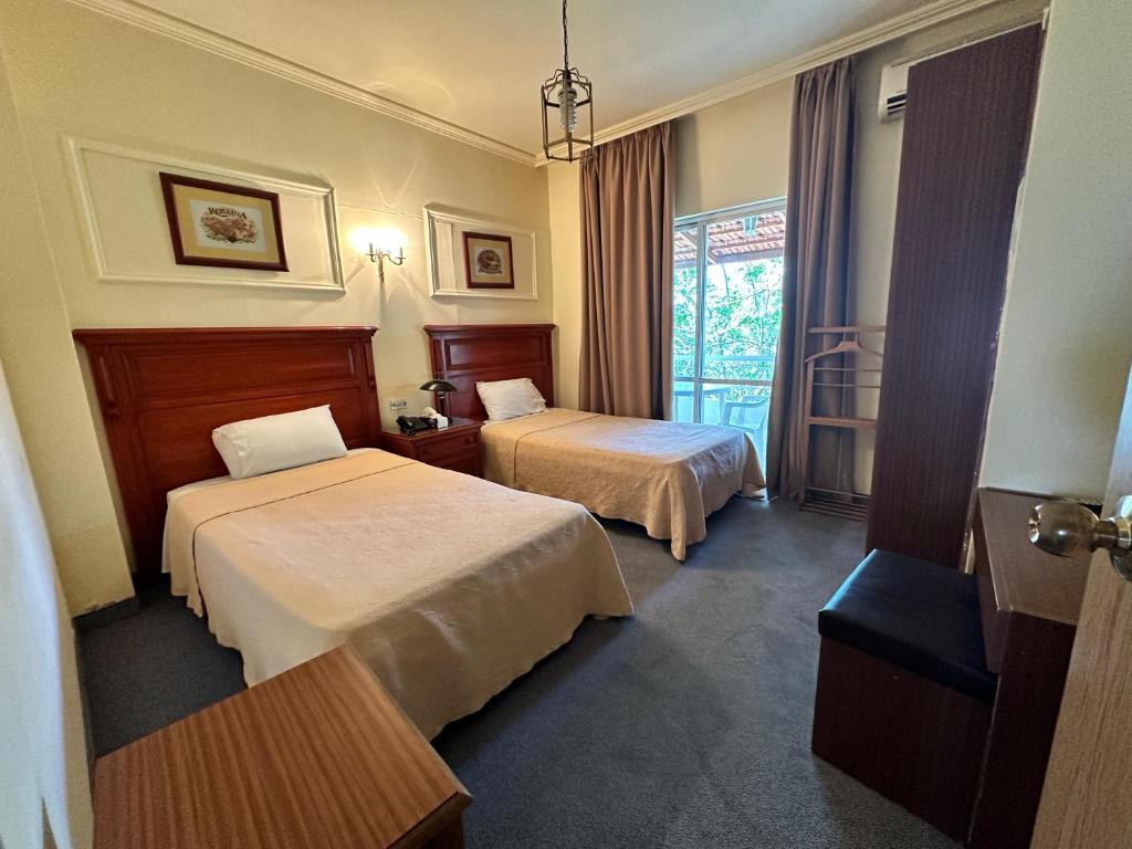 Postel nebo postele na pokoji v ubytování Le Crillon