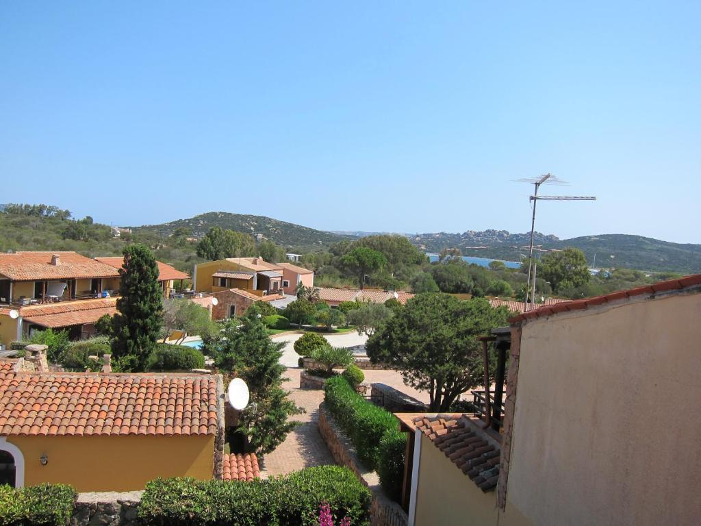 an aerial view of a village with trees and buildings at Tara in Porto Pollo