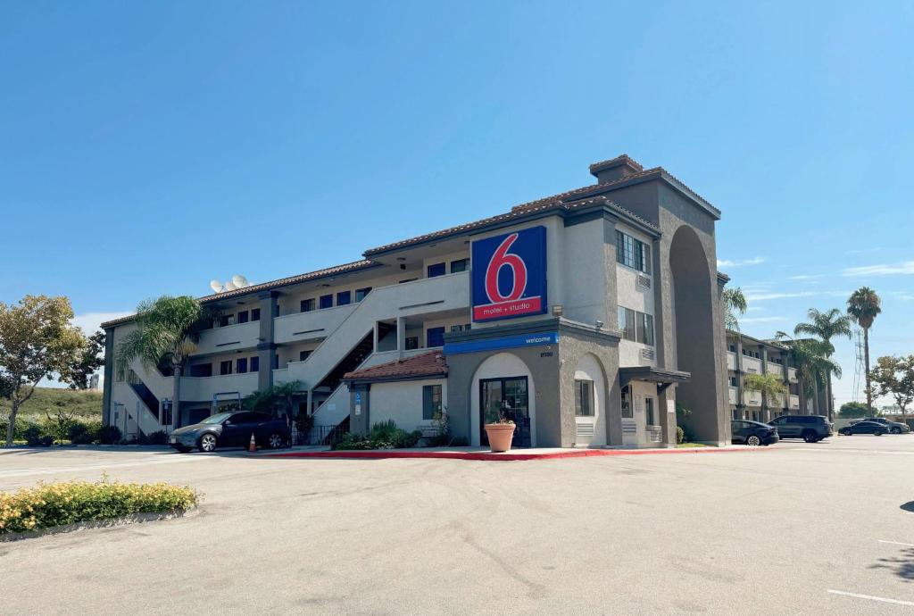 a hotel with a sign on the side of it at Studio 6 Bellflower CA Los Angeles in Bellflower
