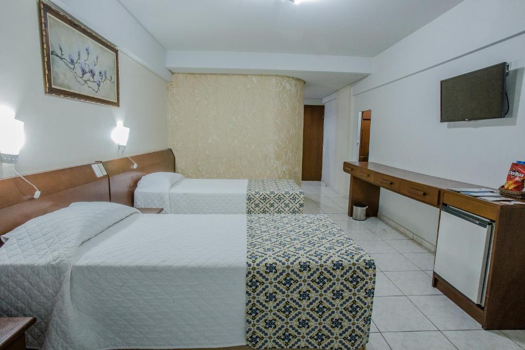 Postel nebo postele na pokoji v ubytování Foz Presidente Comfort Hotel