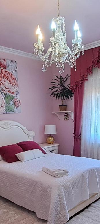 Posteľ alebo postele v izbe v ubytovaní apart romero garden C