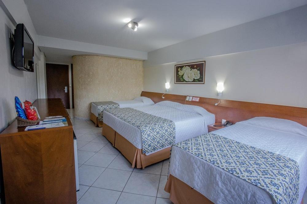Postel nebo postele na pokoji v ubytování Foz Presidente Comfort Hotel