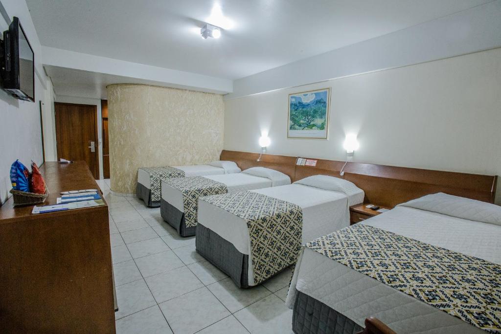 Postel nebo postele na pokoji v ubytování Foz Presidente Comfort Hotel