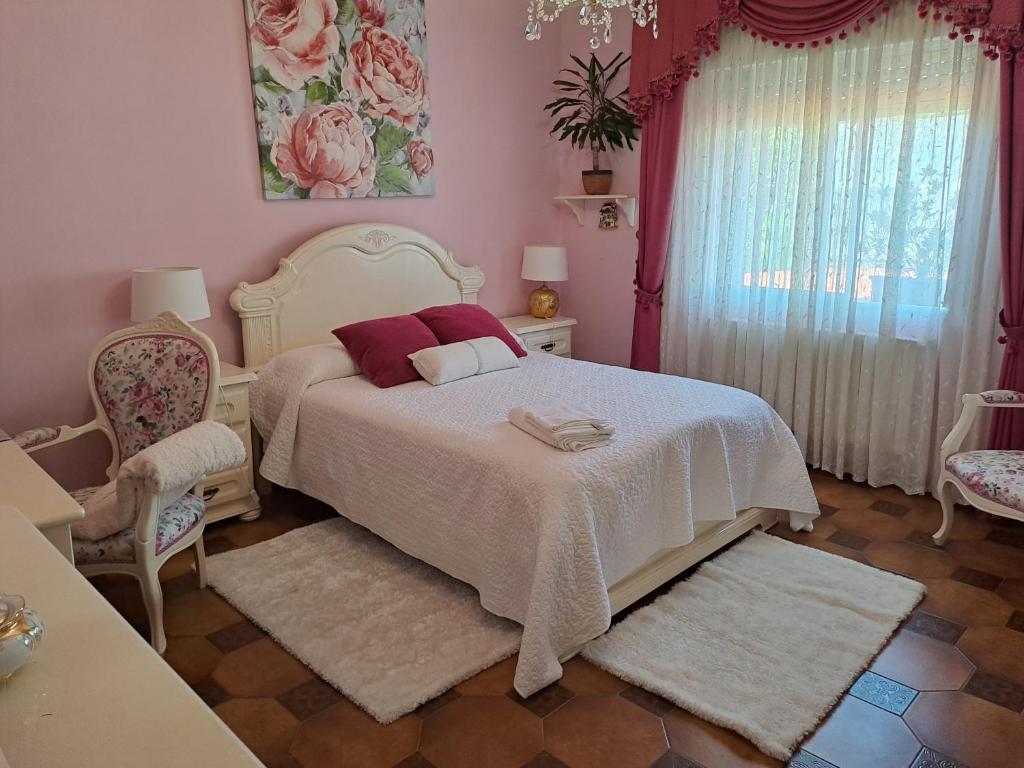 Posteľ alebo postele v izbe v ubytovaní apart romero garden C