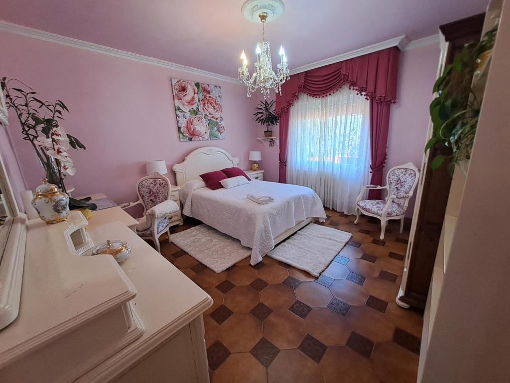 Posteľ alebo postele v izbe v ubytovaní apart romero garden C
