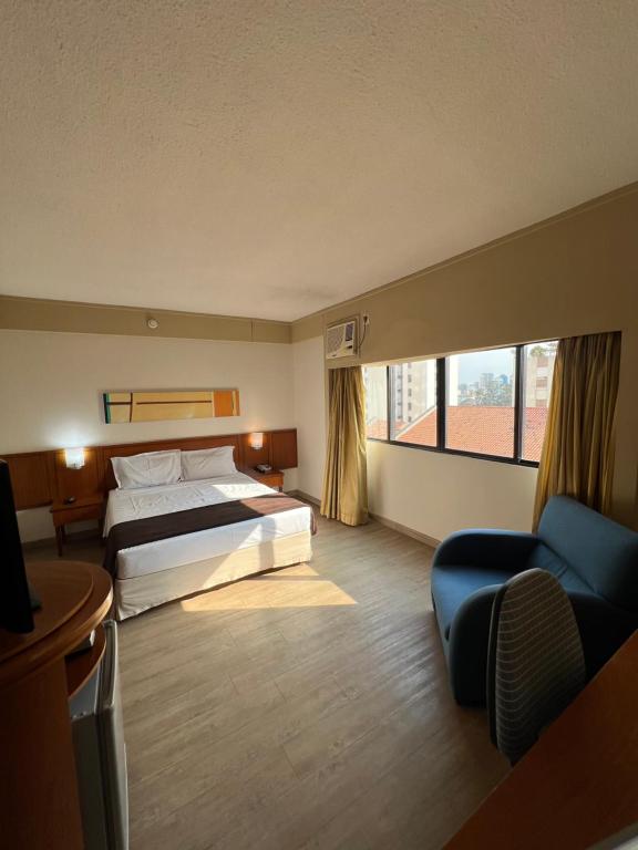 Postel nebo postele na pokoji v ubytování Hotel Live Logde V Mariana Pq Ibirapuera UH-511
