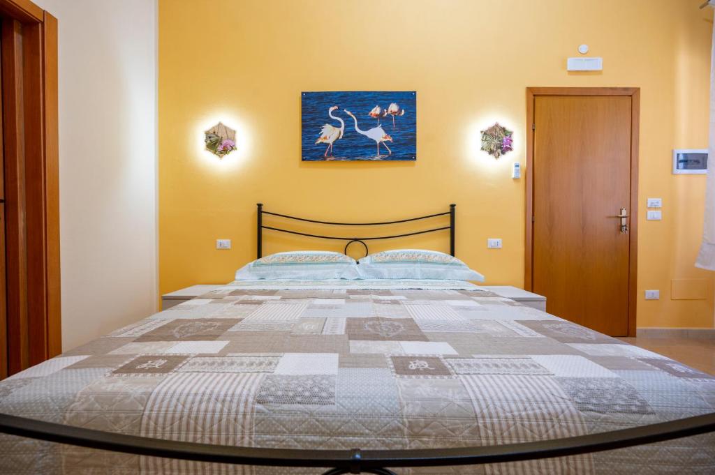 Postel nebo postele na pokoji v ubytování Il cappello sulle 23! Camere in affitto breve