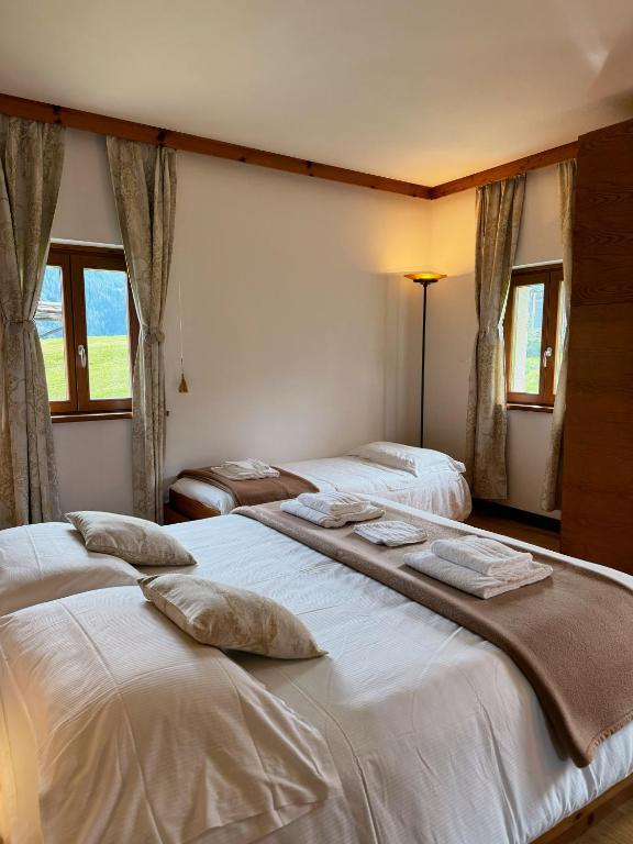 Krevet ili kreveti u jedinici u okviru objekta Neider Hotel - Alpine Retreat Sauris