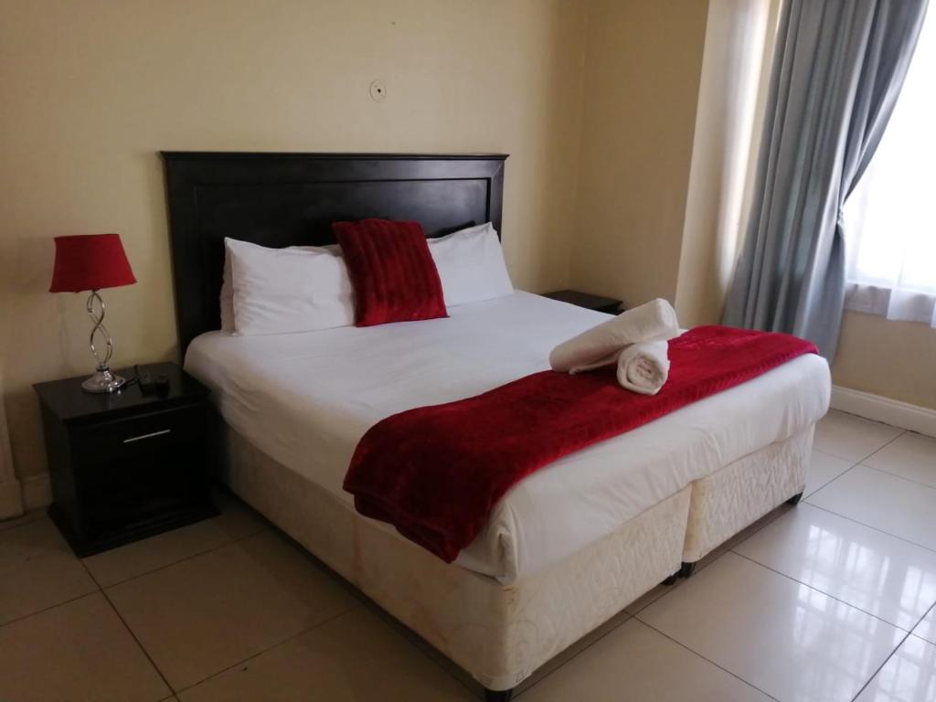 Giường trong phòng chung tại M place B&B