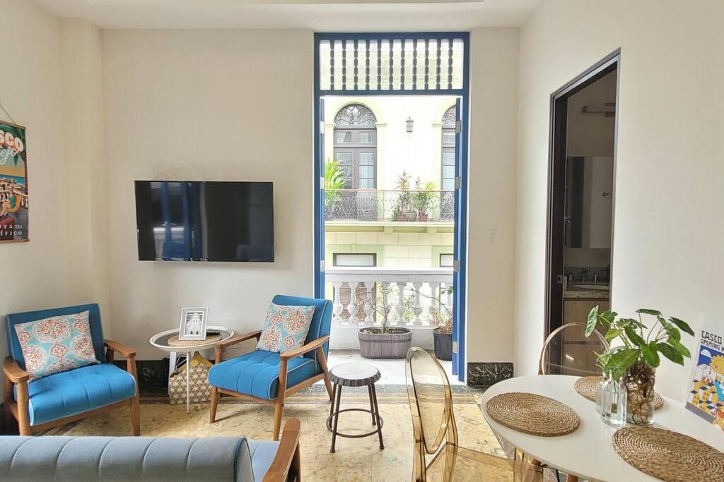 a living room with a couch and a table and chairs at Beautiful apartment in Casco Viejo, Casa Rio Apt #2 in Panama City