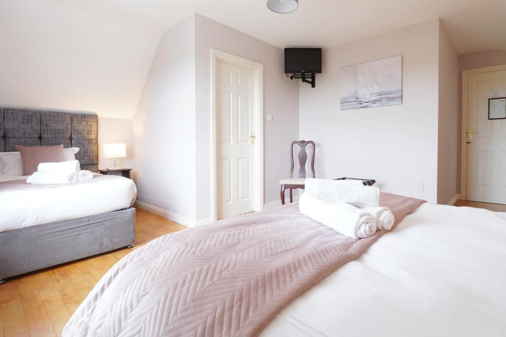 Postel nebo postele na pokoji v ubytování Ashville Guesthouse