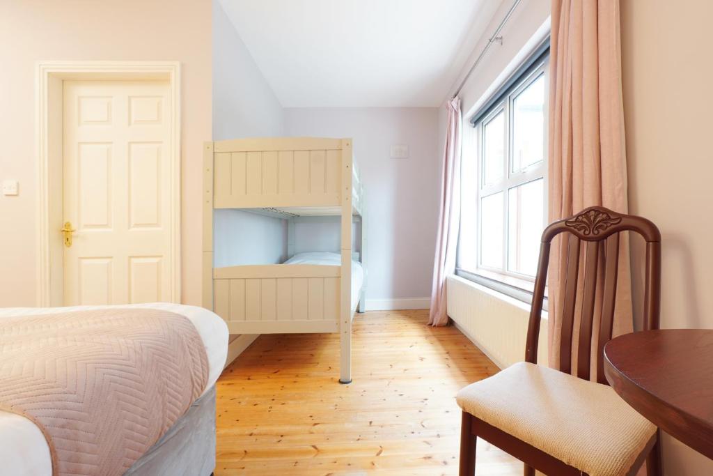 Postel nebo postele na pokoji v ubytování Ashville Guesthouse