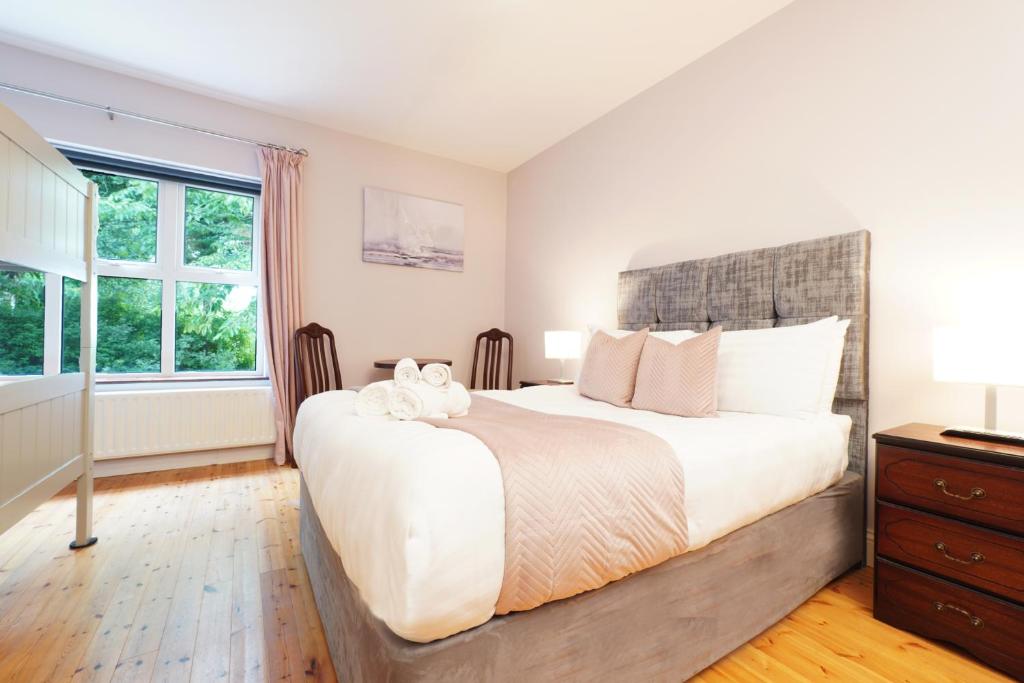 Postel nebo postele na pokoji v ubytování Ashville Guesthouse
