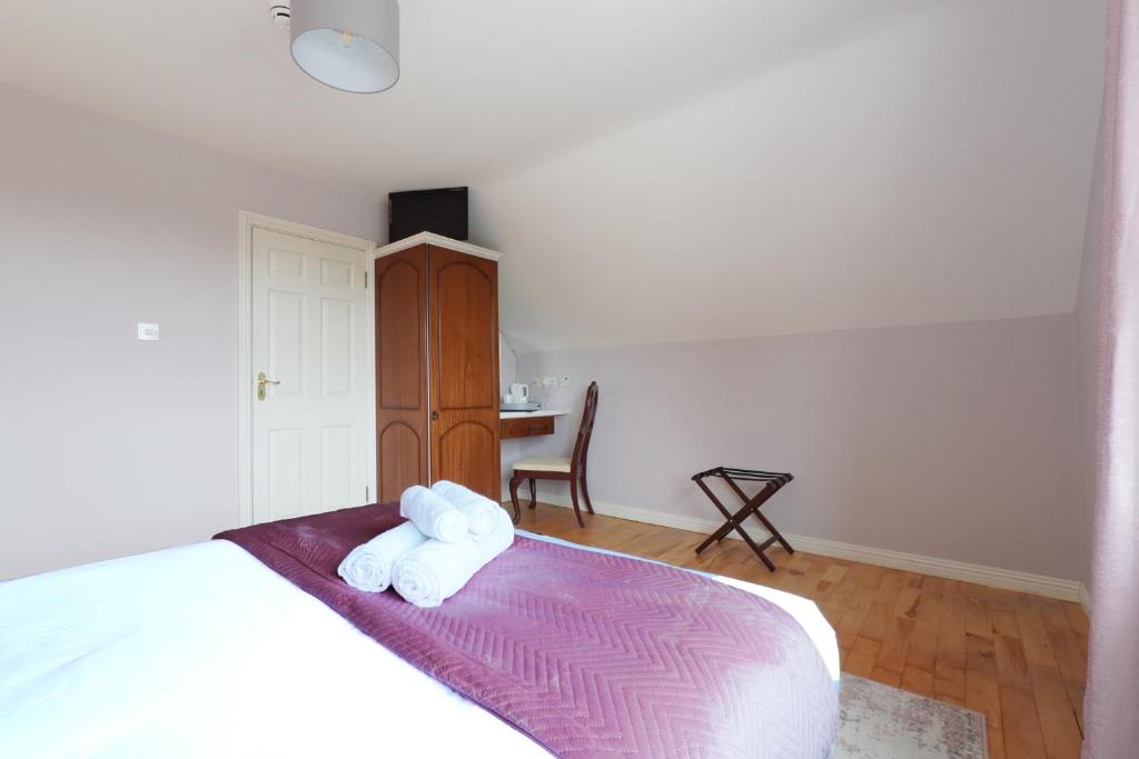 Postel nebo postele na pokoji v ubytování Ashville Guesthouse