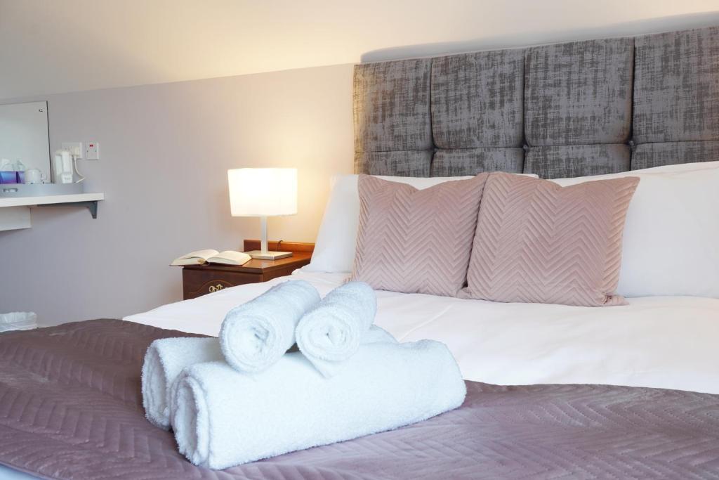 Postel nebo postele na pokoji v ubytování Ashville Guesthouse