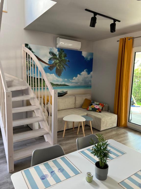 a living room with a mural of the ocean at Palm Beach in Dziwnówek