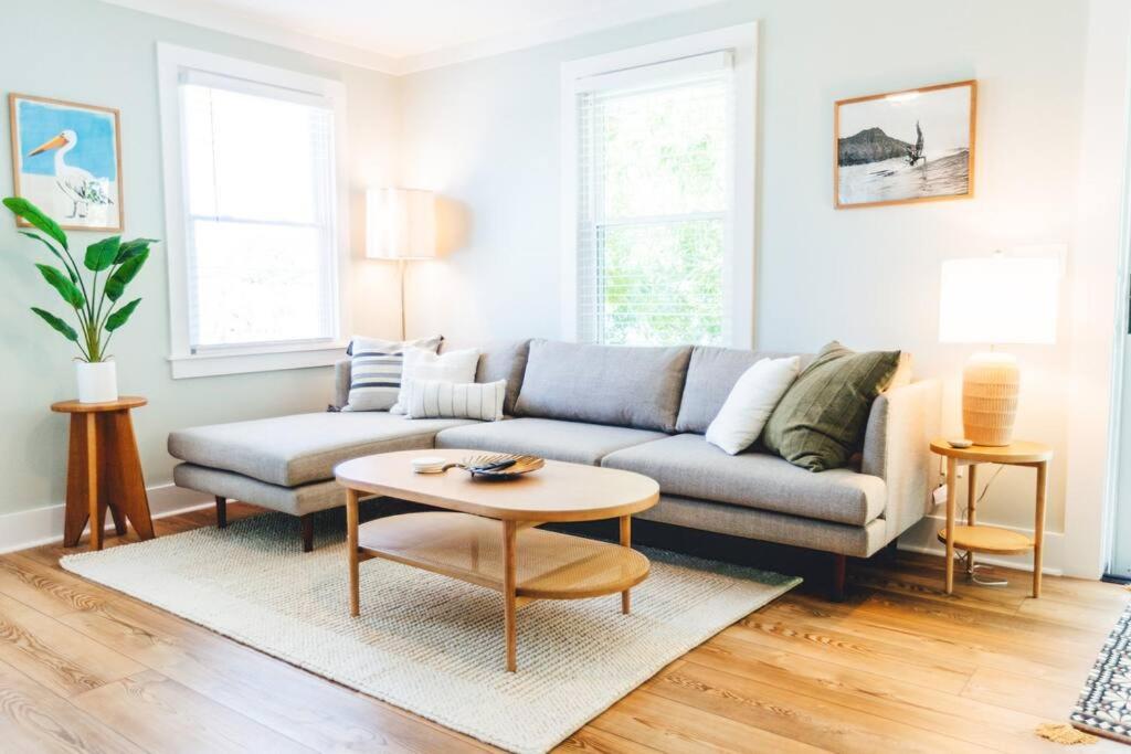 a living room with a couch and a coffee table at NEW! 1937 Coastal Cottage by Beach, Boardwalk, & Lake! in Carolina Beach