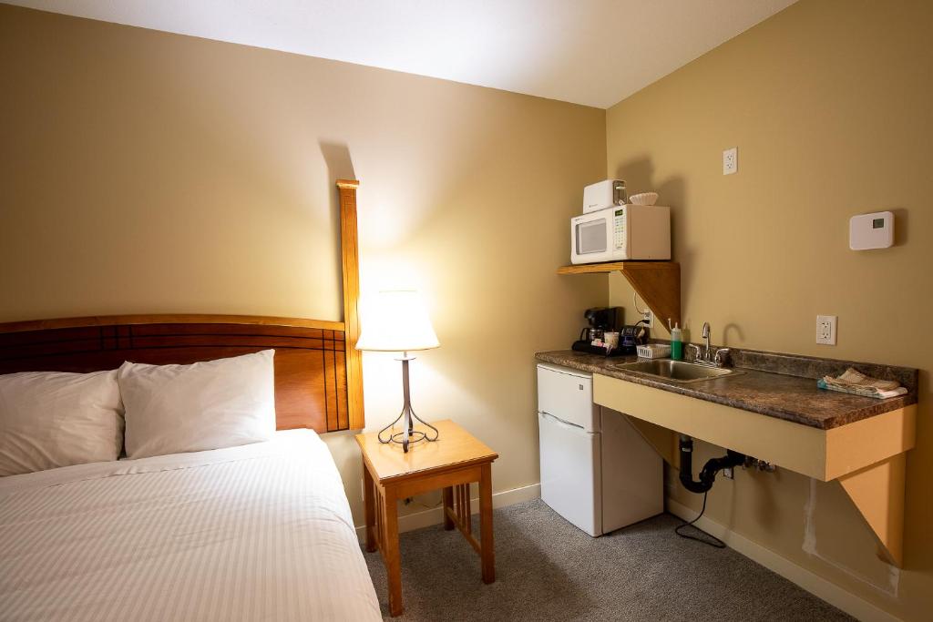 Postel nebo postele na pokoji v ubytování Northway Motor Inn