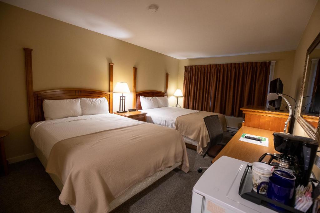 Postel nebo postele na pokoji v ubytování Northway Motor Inn