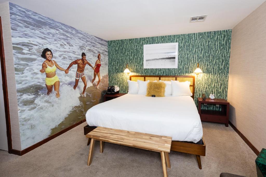 Postel nebo postele na pokoji v ubytování Daddy O Hotel
