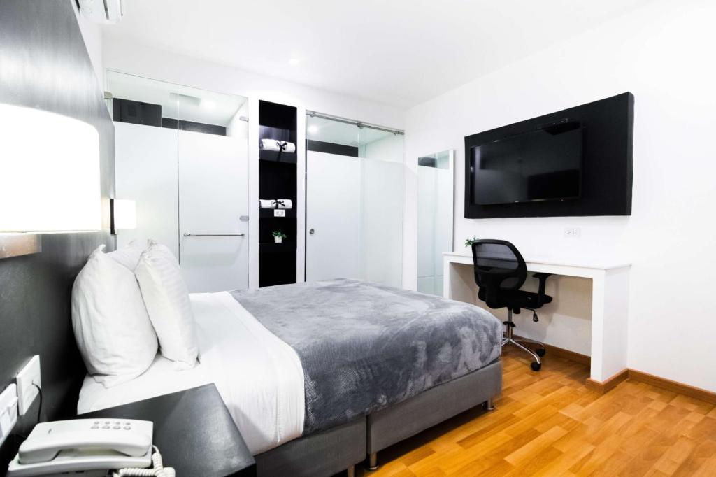 Postel nebo postele na pokoji v ubytování Hotel Z3 Pereira