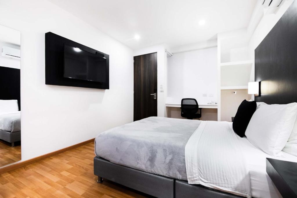 Postel nebo postele na pokoji v ubytování Hotel Z3 Pereira