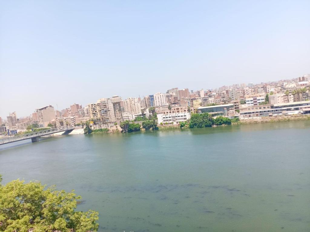 a river with a city in the background at لم تعد الشقه متوفره برجاء عدم الحجز لا استطيع ازاله الاعلان او التواصل مع الدعم in Mansoura