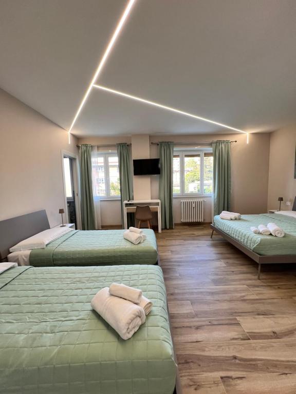 Postel nebo postele na pokoji v ubytování Raffaelli Suite