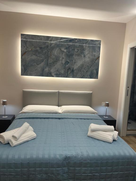 Postel nebo postele na pokoji v ubytování Raffaelli Suite
