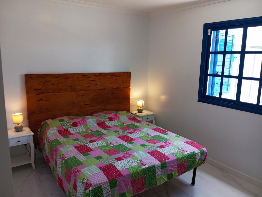 En eller flere senge i et værelse på Vivienda del Sol