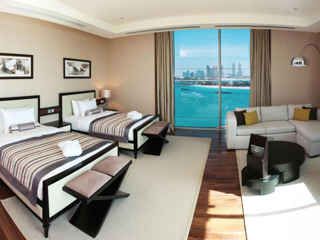 Ein Bett oder Betten in einem Zimmer der Unterkunft Rixos The Palm Hotel &amp; Suites - Ultra All Inclusive