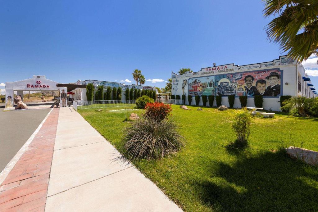 a building with a mural on the side of it at Ramada by Wyndham Kingman in Kingman