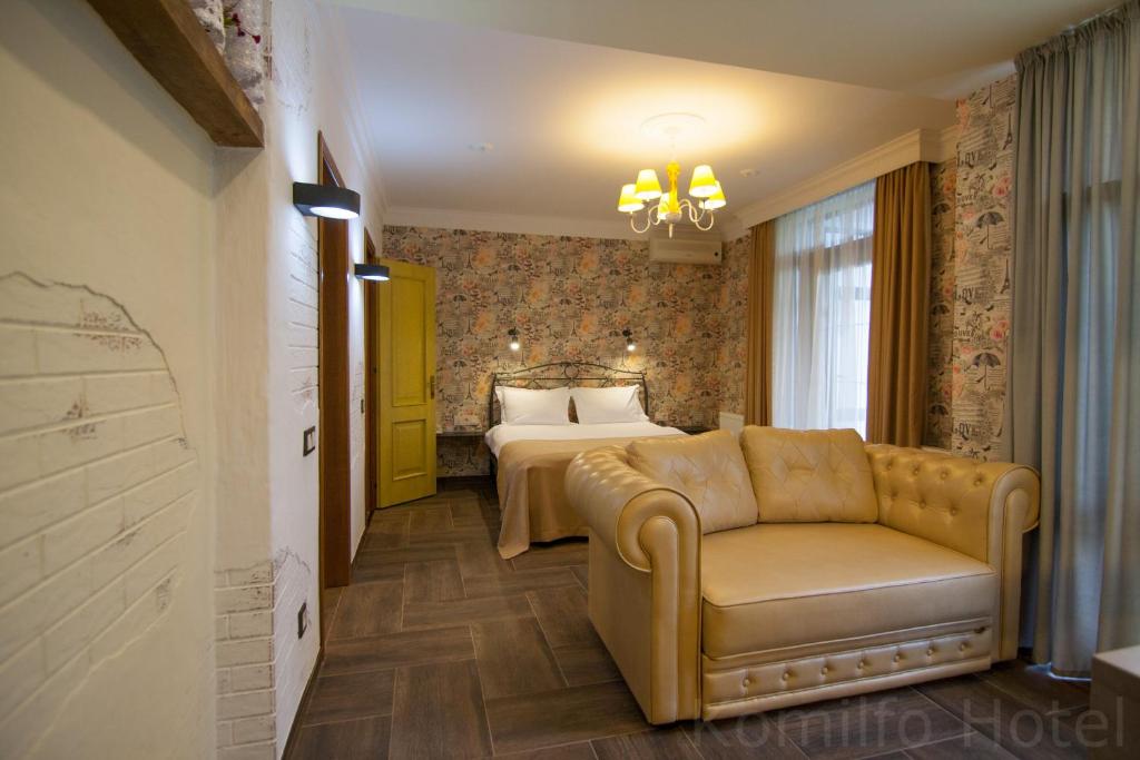Postel nebo postele na pokoji v ubytování Komilfo Hotel