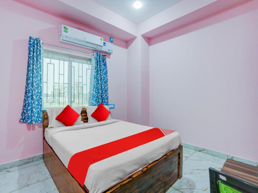 Postel nebo postele na pokoji v ubytování Hotel O Kalinga Inn