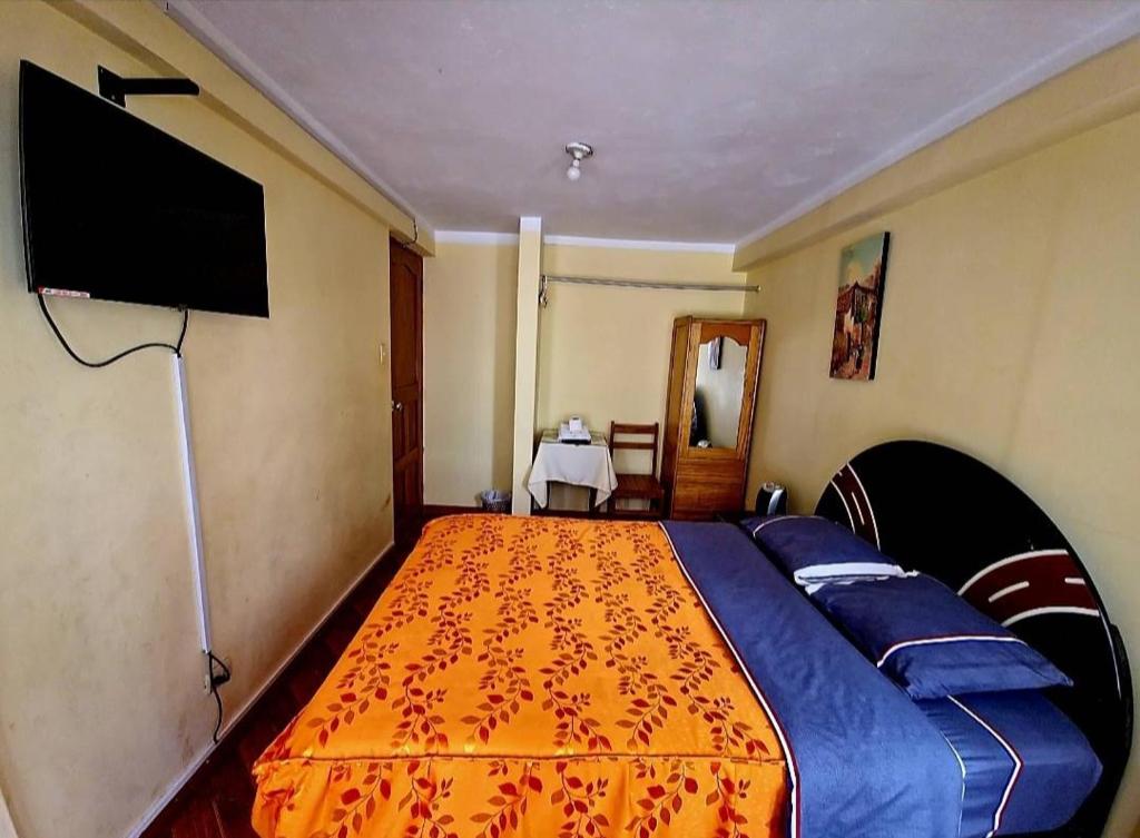 TV a/nebo společenská místnost v ubytování Hospedaje Qoricha'skas