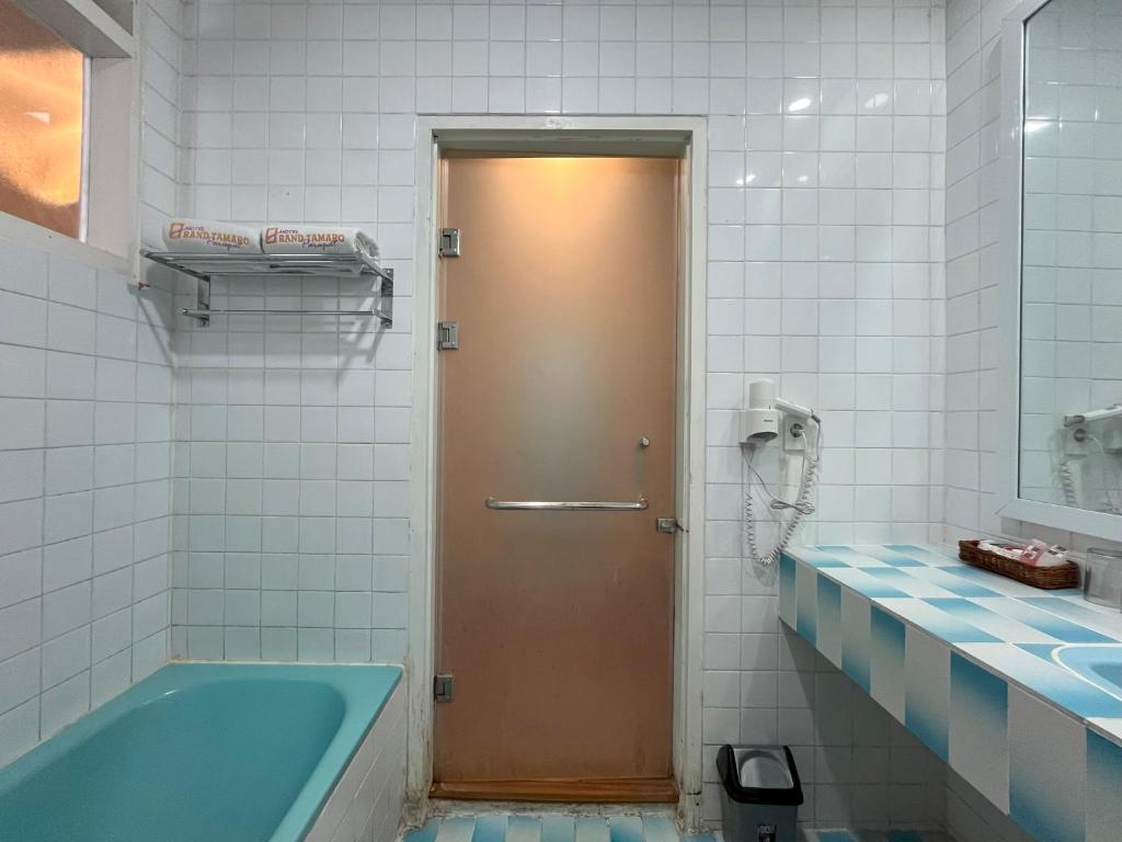 Koupelna v ubytování Grand Tamaro Hotel
