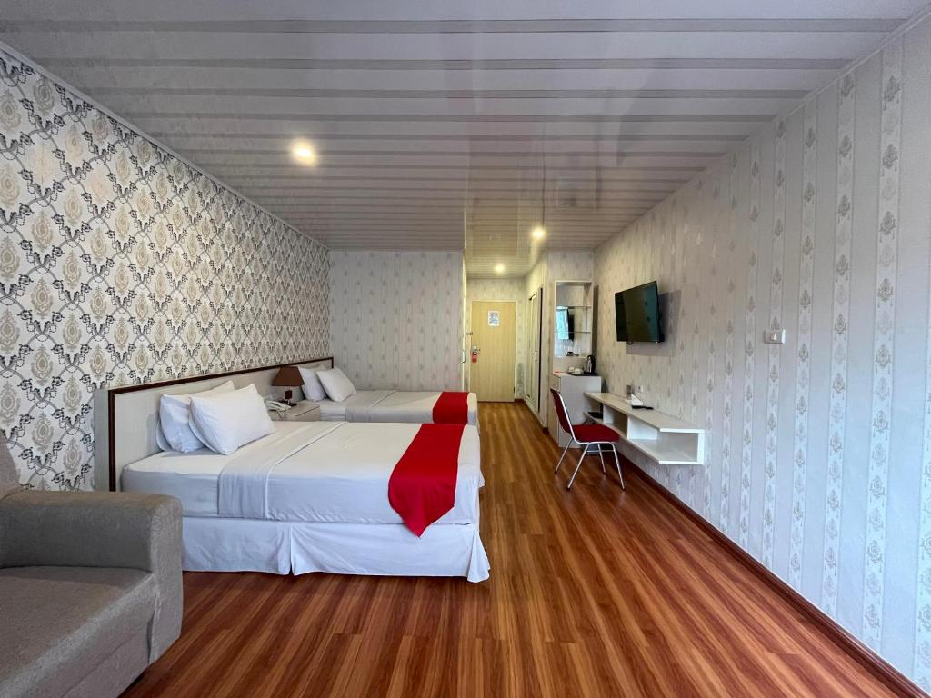 Postel nebo postele na pokoji v ubytování Grand Tamaro Hotel