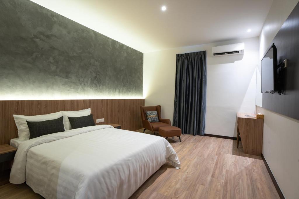 Postel nebo postele na pokoji v ubytování Blu Sentral Hotel